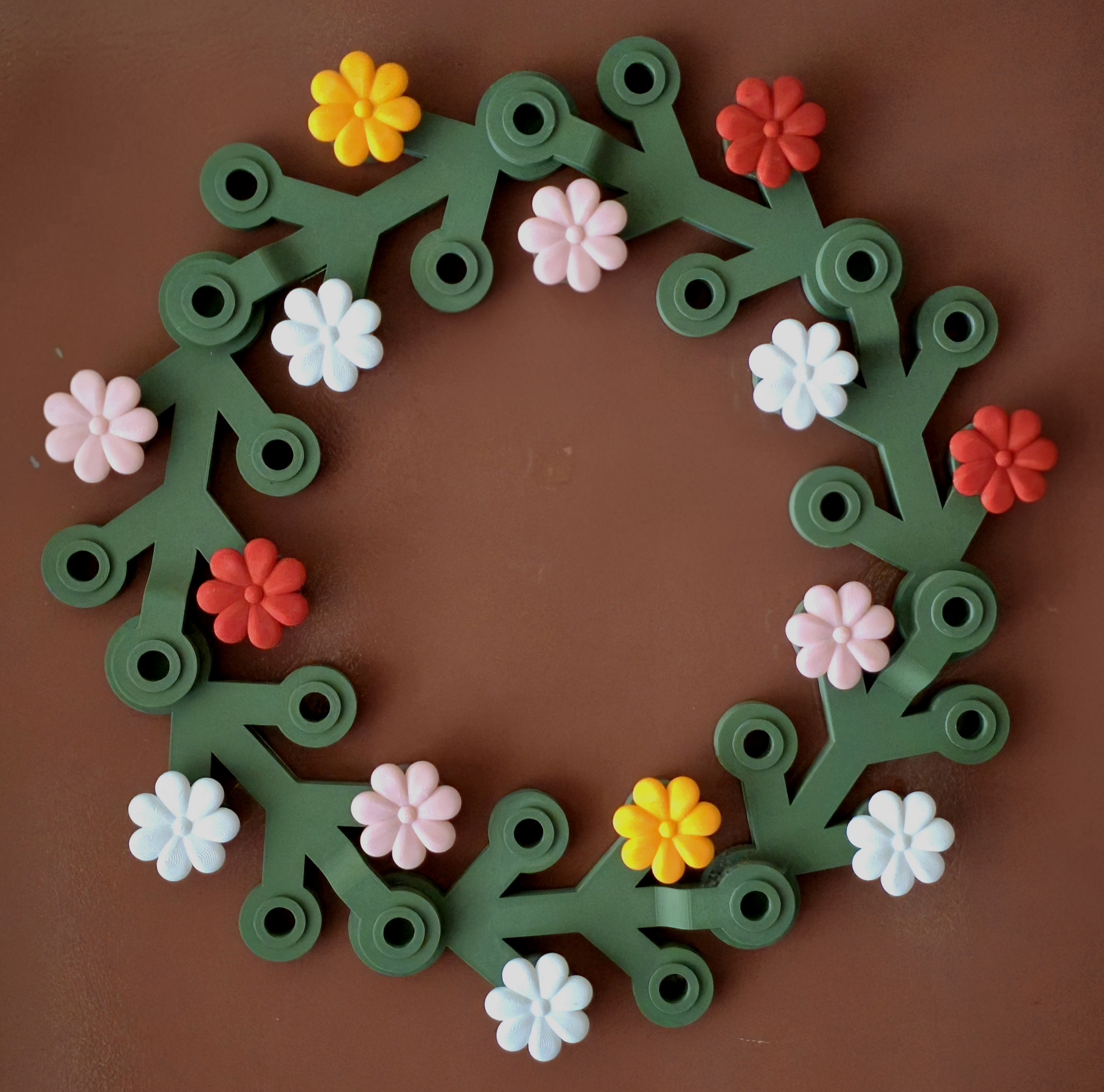 Wreath with Summer Flower Ornaments Mounted on a Door